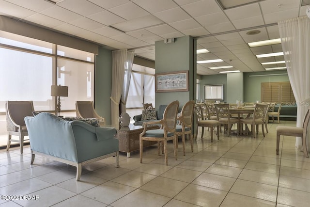 common area with a paneled ceiling