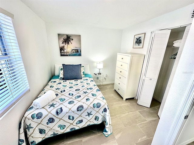 3112 S Atlantic Ave, Daytona Beach, FL 32118 - bedroom featuring a closet and light tile patterned floors