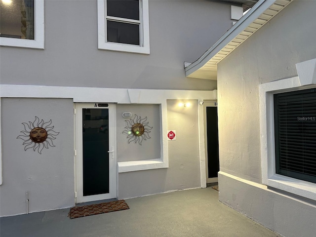 3112 S Atlantic Ave, Daytona Beach, FL 32118 - doorway to property featuring stucco siding