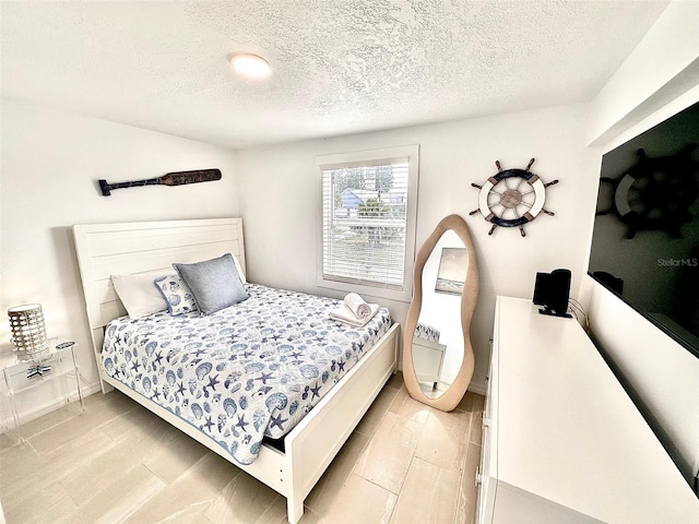 3112 S Atlantic Ave, Daytona Beach, FL 32118 - bedroom with a textured ceiling
