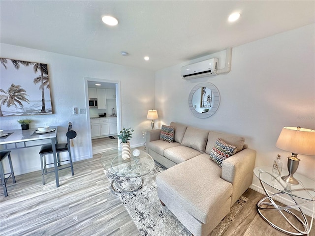 3112 S Atlantic Ave, Daytona Beach, FL 32118 - living area with a wall unit AC, light wood-style flooring, baseboards, and recessed lighting