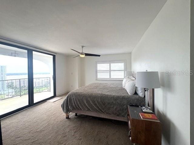 carpeted bedroom featuring access to outside and a ceiling fan