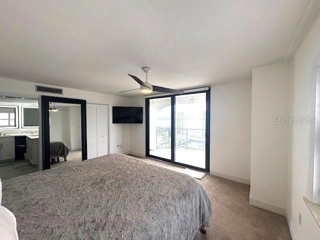 bedroom featuring light colored carpet, baseboards, ceiling fan, and access to outside