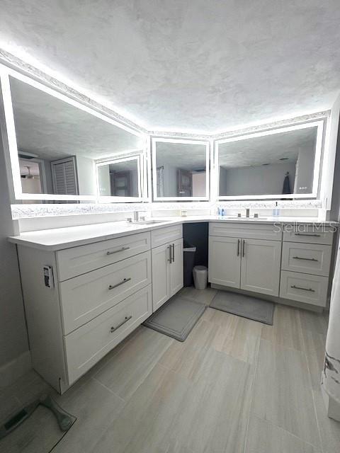 bathroom featuring vanity and wood finished floors