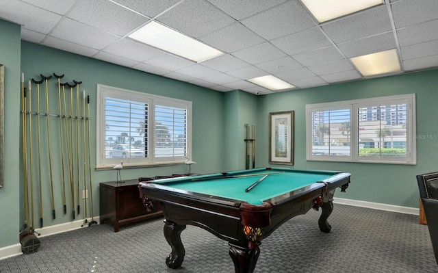 game room with a paneled ceiling, carpet flooring, baseboards, and pool table