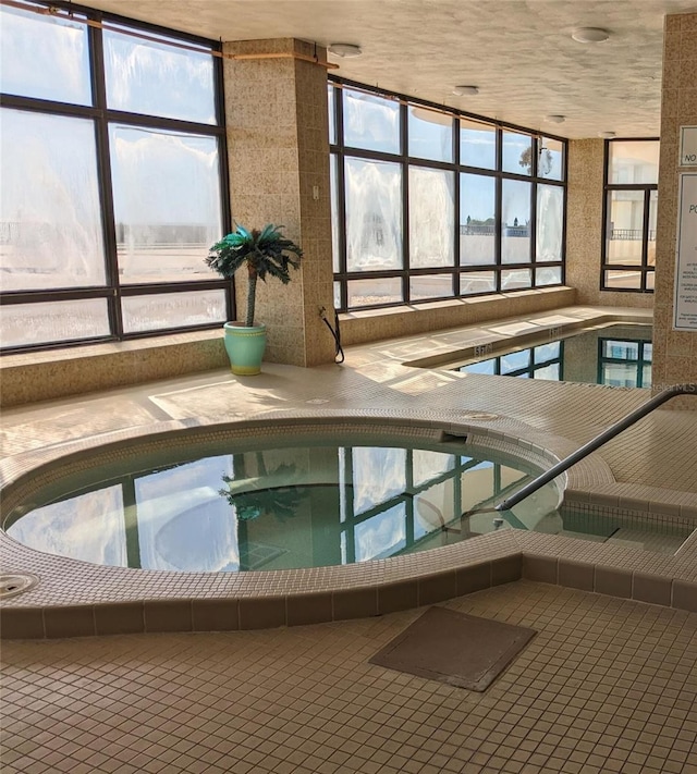 indoor pool with an in-ground hot tub