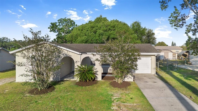 541 Northwestern Ave, Altamonte Springs, FL 32714 - view of front of home featuring driveway, stucco siding, a garage, and a front yard