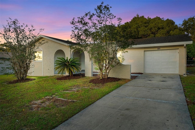 541 Northwestern Ave, Altamonte Springs, FL 32714 - view of front of home featuring concrete driveway, stucco siding, an attached garage, and a front lawn