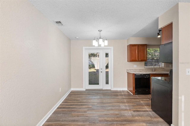 541 Northwestern Ave, Altamonte Springs, FL 32714 - kitchen with black dishwasher, a sink, dark wood-type flooring, a chandelier, and a textured ceiling