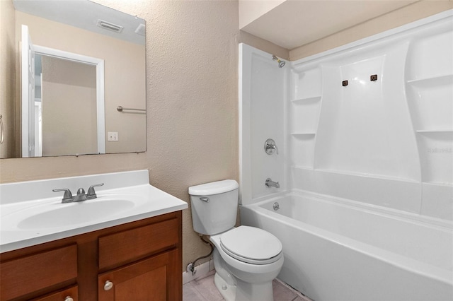 541 Northwestern Ave, Altamonte Springs, FL 32714 - full bathroom featuring toilet, vanity, a textured wall, shower / bathtub combination, and tile patterned flooring