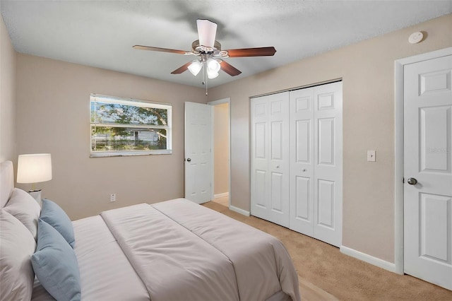 541 Northwestern Ave, Altamonte Springs, FL 32714 - bedroom with light colored carpet, baseboards, a closet, and a ceiling fan