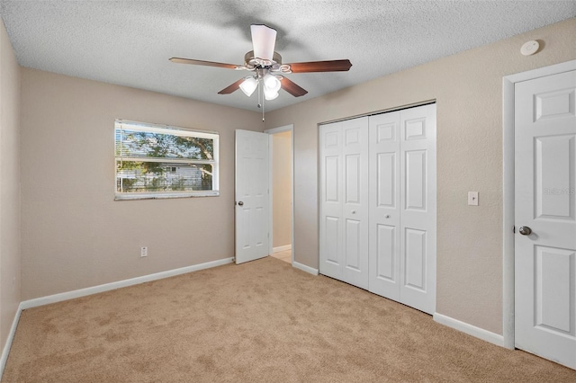 541 Northwestern Ave, Altamonte Springs, FL 32714 - unfurnished bedroom with light carpet, a closet, a textured ceiling, baseboards, and ceiling fan