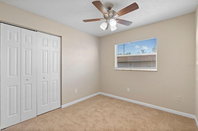 541 Northwestern Ave, Altamonte Springs, FL 32714 - unfurnished bedroom featuring carpet floors, a closet, baseboards, a ceiling fan, and a textured ceiling