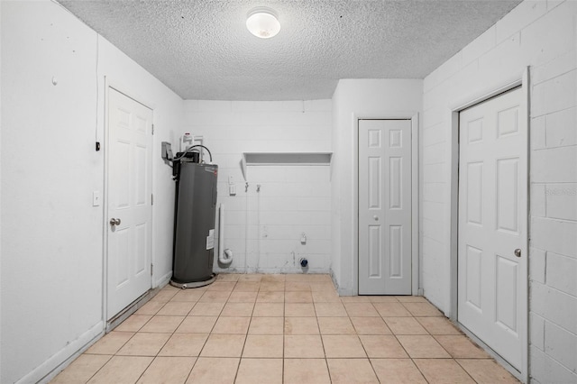 541 Northwestern Ave, Altamonte Springs, FL 32714 - laundry room featuring electric water heater and a textured ceiling