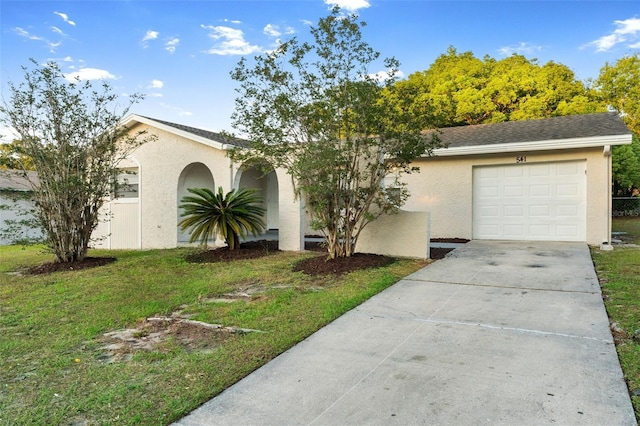 541 Northwestern Ave, Altamonte Springs, FL 32714 - view of front of house with concrete driveway, a garage, a front yard, and stucco siding