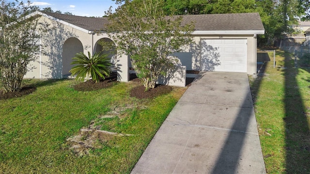 541 Northwestern Ave, Altamonte Springs, FL 32714 - view of front of house with concrete driveway, stucco siding, an attached garage, and roof with shingles