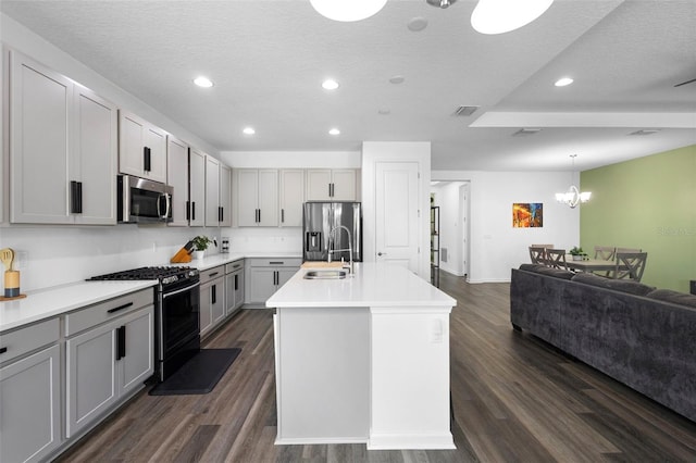 518 Briarbrook Way, Deland, FL 32724 - kitchen with appliances with stainless steel finishes, gray cabinetry, open floor plan, recessed lighting, and dark wood-type flooring