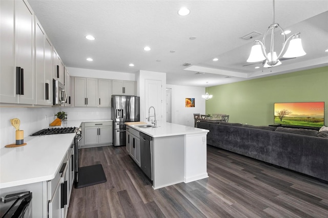 518 Briarbrook Way, Deland, FL 32724 - kitchen featuring a chandelier, stainless steel appliances, a sink, dark wood finished floors, and open floor plan