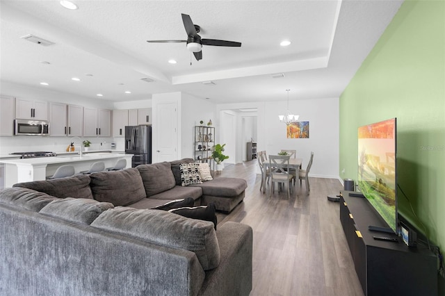 518 Briarbrook Way, Deland, FL 32724 - living area featuring light wood-style floors, recessed lighting, a chandelier, ceiling fan, and baseboards