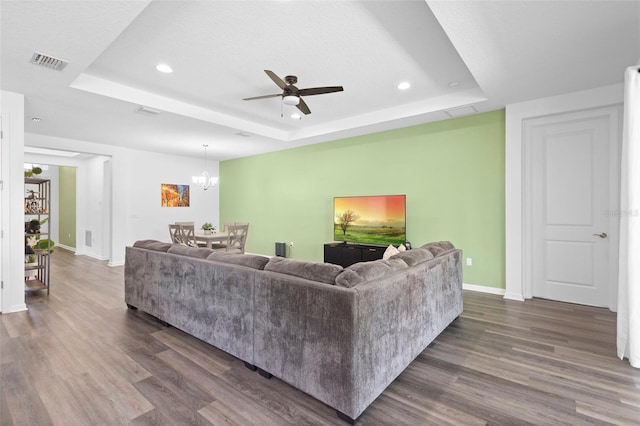 518 Briarbrook Way, Deland, FL 32724 - living area featuring a raised ceiling, baseboards, recessed lighting, dark wood-type flooring, and ceiling fan