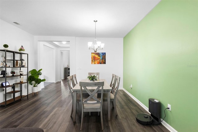 518 Briarbrook Way, Deland, FL 32724 - dining area featuring dark wood finished floors, a chandelier, and baseboards