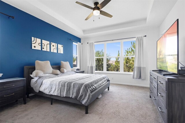 518 Briarbrook Way, Deland, FL 32724 - bedroom with a raised ceiling, carpet flooring, baseboards, and a ceiling fan