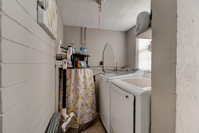 26 Ocean Shore Dr, Ormond Beach, FL 32176 - washroom with washer and dryer and a textured ceiling