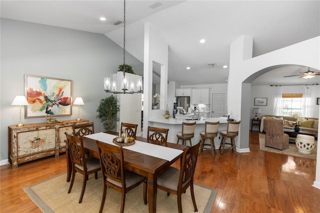 1412 Bent Oaks Blvd, Deland, FL 32724 - dining area with arched walkways, a chandelier, light wood finished floors, ceiling fan, and recessed lighting