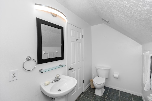 1412 Bent Oaks Blvd, Deland, FL 32724 - half bath with a textured ceiling, tile patterned floors, and lofted ceiling