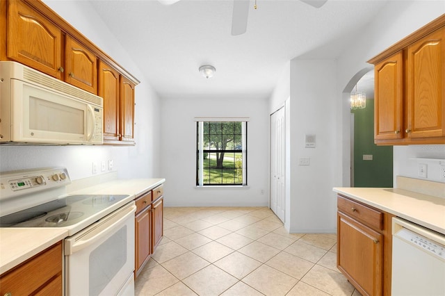 1120 W Glen Falls Rd, Deland, FL 32720 - kitchen featuring white appliances, light countertops, ceiling fan, arched walkways, and brown cabinets