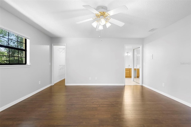 1120 W Glen Falls Rd, Deland, FL 32720 - spare room featuring wood finished floors, baseboards, and a ceiling fan