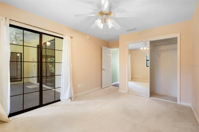 1120 W Glen Falls Rd, Deland, FL 32720 - unfurnished bedroom with carpet floors, baseboards, a closet, and a ceiling fan