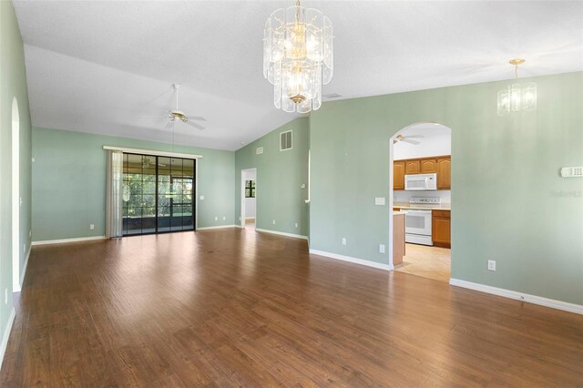1120 W Glen Falls Rd, Deland, FL 32720 - unfurnished living room with a chandelier, a ceiling fan, lofted ceiling, arched walkways, and light wood-type flooring