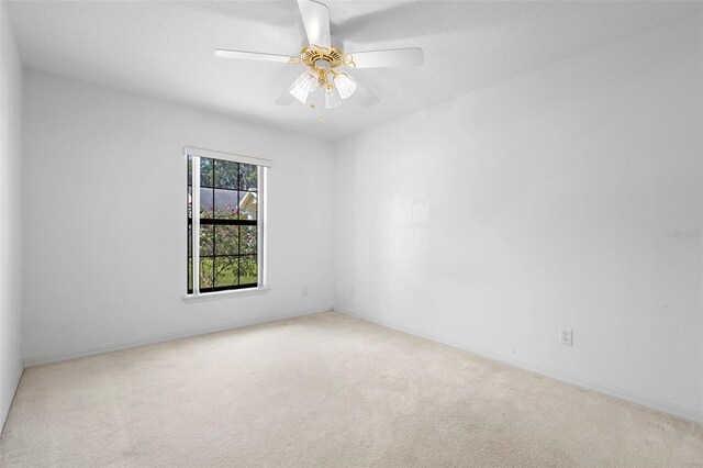 1120 W Glen Falls Rd, Deland, FL 32720 - carpeted spare room featuring a ceiling fan and baseboards