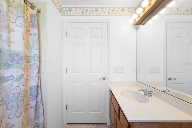1120 W Glen Falls Rd, Deland, FL 32720 - bathroom with vanity, a shower with curtain, and tile patterned floors