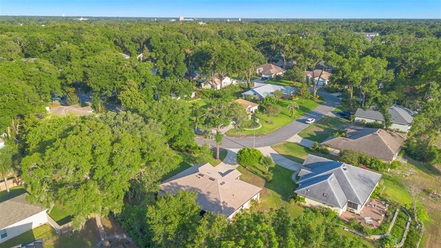 1120 W Glen Falls Rd, Deland, FL 32720 - aerial view of property and surrounding area featuring a forest and nearby suburban area