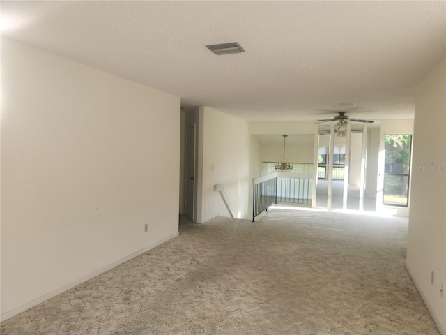 8 Oxford Ln, Palm Coast, FL 32137 - carpeted spare room featuring a chandelier and ceiling fan