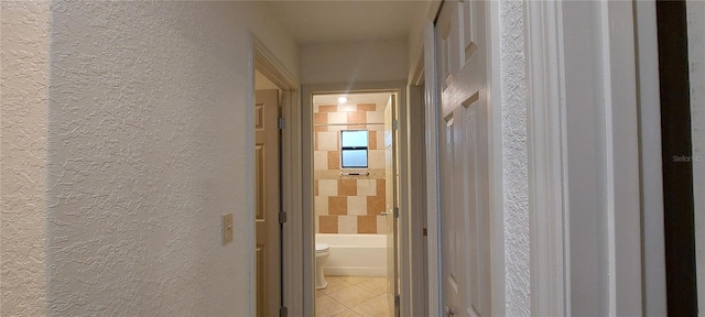 1621 Anniston Ave, Daytona Beach, FL 32117 - corridor with a textured wall and light tile patterned floors