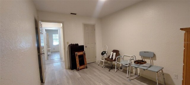 1621 Anniston Ave, Daytona Beach, FL 32117 - living area featuring light wood-type flooring and a textured wall