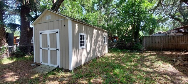 1621 Anniston Ave, Daytona Beach, FL 32117 - view of shed featuring a fenced backyard