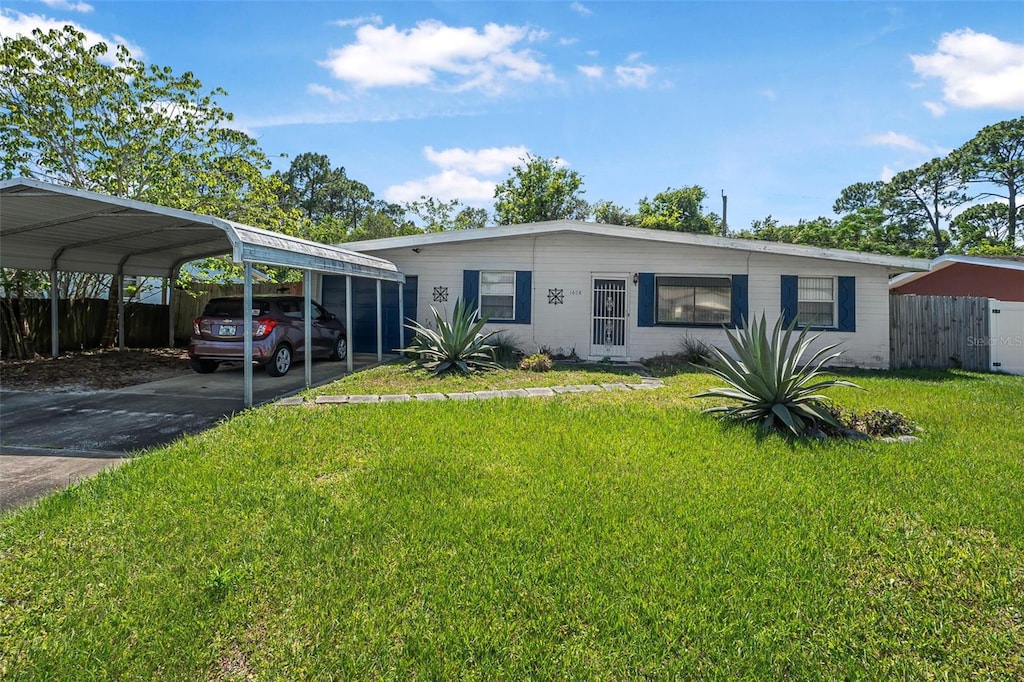 1608 Raleigh Ave, Daytona Beach, FL 32117 - view of front of home with a detached carport and driveway