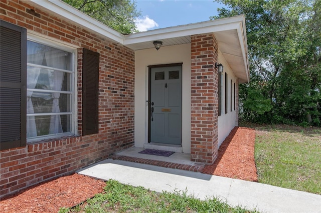 2842 English Dr, Deltona, FL 32738 - doorway to property featuring brick siding