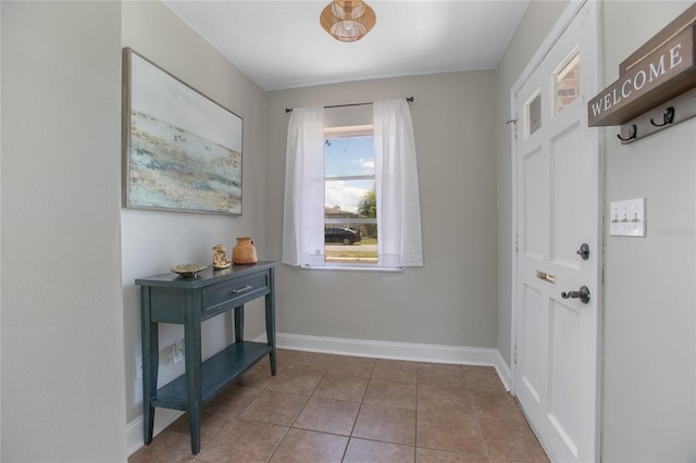 2842 English Dr, Deltona, FL 32738 - doorway featuring baseboards and tile patterned flooring
