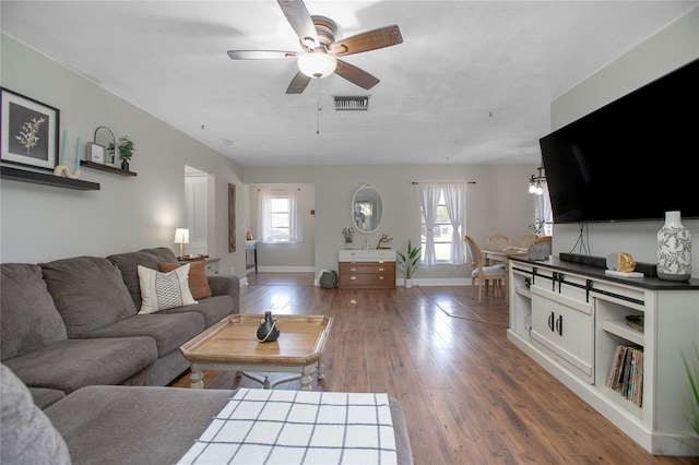 2842 English Dr, Deltona, FL 32738 - living area featuring a ceiling fan, baseboards, plenty of natural light, and wood finished floors