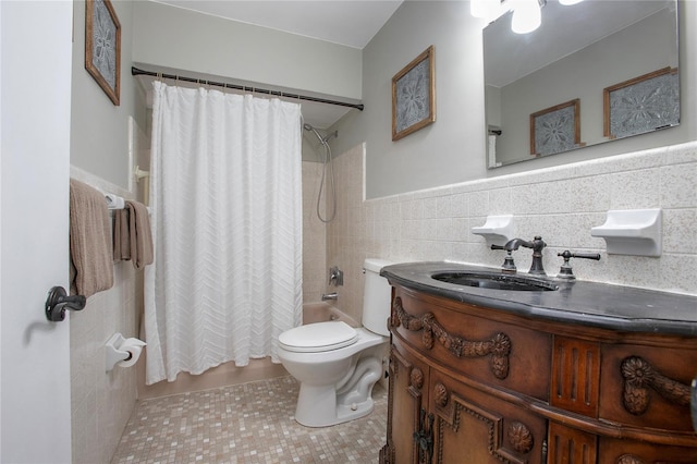 2842 English Dr, Deltona, FL 32738 - full bath with tile walls, shower / bath combo with shower curtain, tile patterned floors, toilet, and vanity