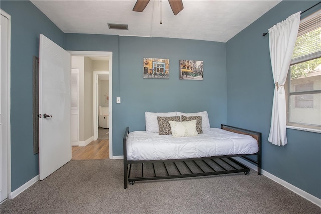 2842 English Dr, Deltona, FL 32738 - carpeted bedroom with baseboards and a ceiling fan