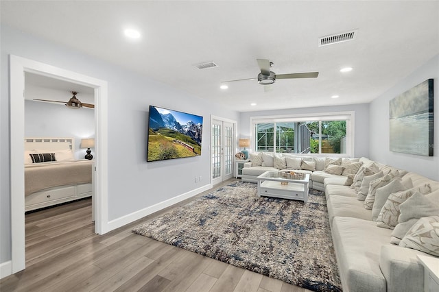 809 E 14th Ave, New Smyrna Beach, FL 32169 - living room with a ceiling fan, wood finished floors, baseboards, recessed lighting, and french doors