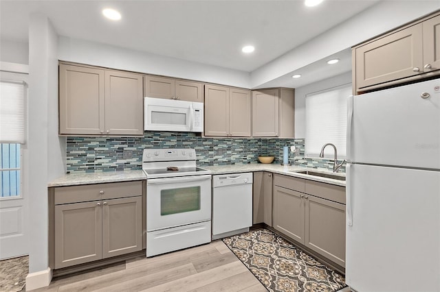 809 E 14th Ave, New Smyrna Beach, FL 32169 - kitchen featuring white appliances, a sink, gray cabinetry, light wood-style floors, and recessed lighting