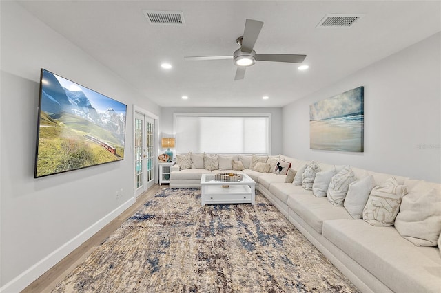 809 E 14th Ave, New Smyrna Beach, FL 32169 - living room with light wood finished floors, ceiling fan, recessed lighting, and baseboards