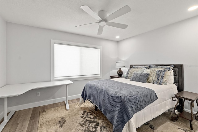 809 E 14th Ave, New Smyrna Beach, FL 32169 - bedroom with wood finished floors, ceiling fan, baseboards, and recessed lighting